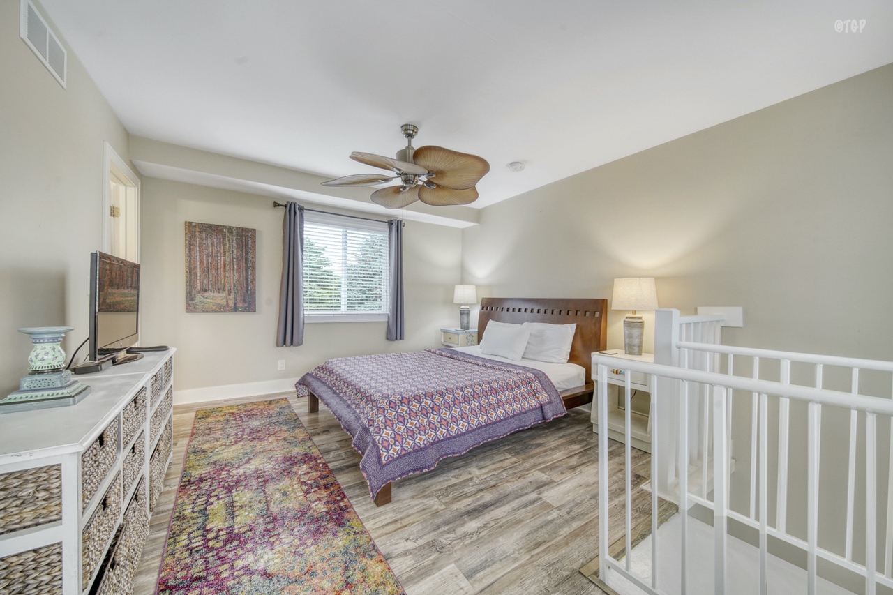 The bedroom in the 1 bed 1.5 bath Northern Lights Condo Resort Unit 13 is comfortable and inviting.