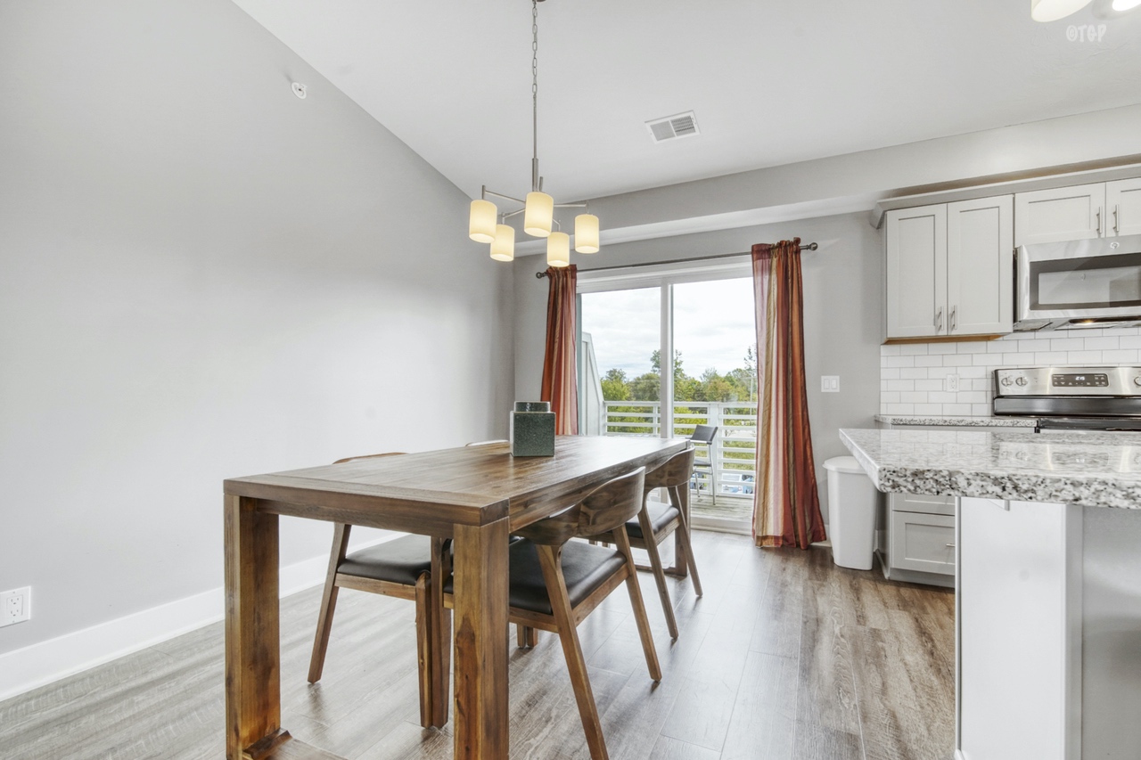 The kitchen table in Northern Lights Condo Resort Unit 36 is roomy enough to seat a whole family.