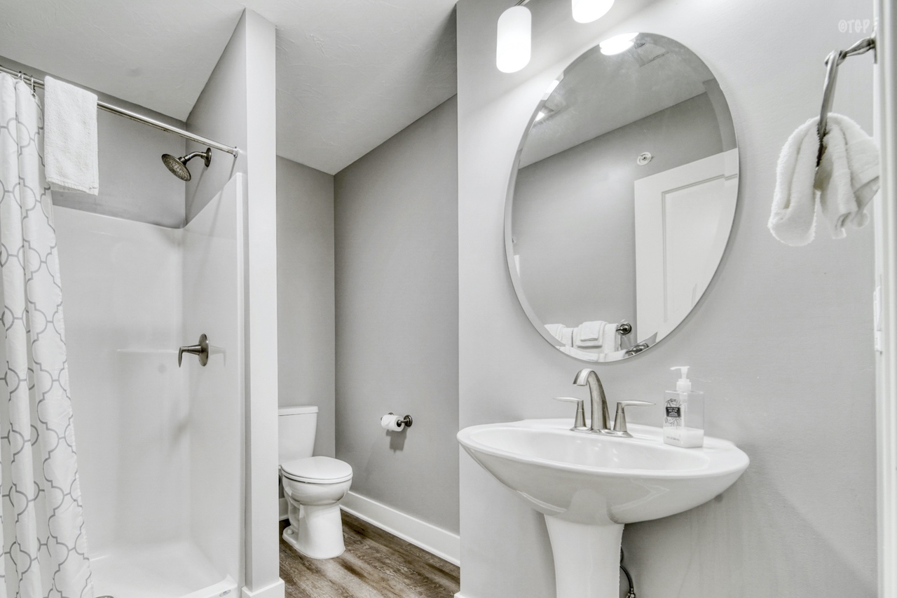 The first bathroom in the 2 bed 2 bath Northern Lights Condo Resort Unit 36 includes a shower.